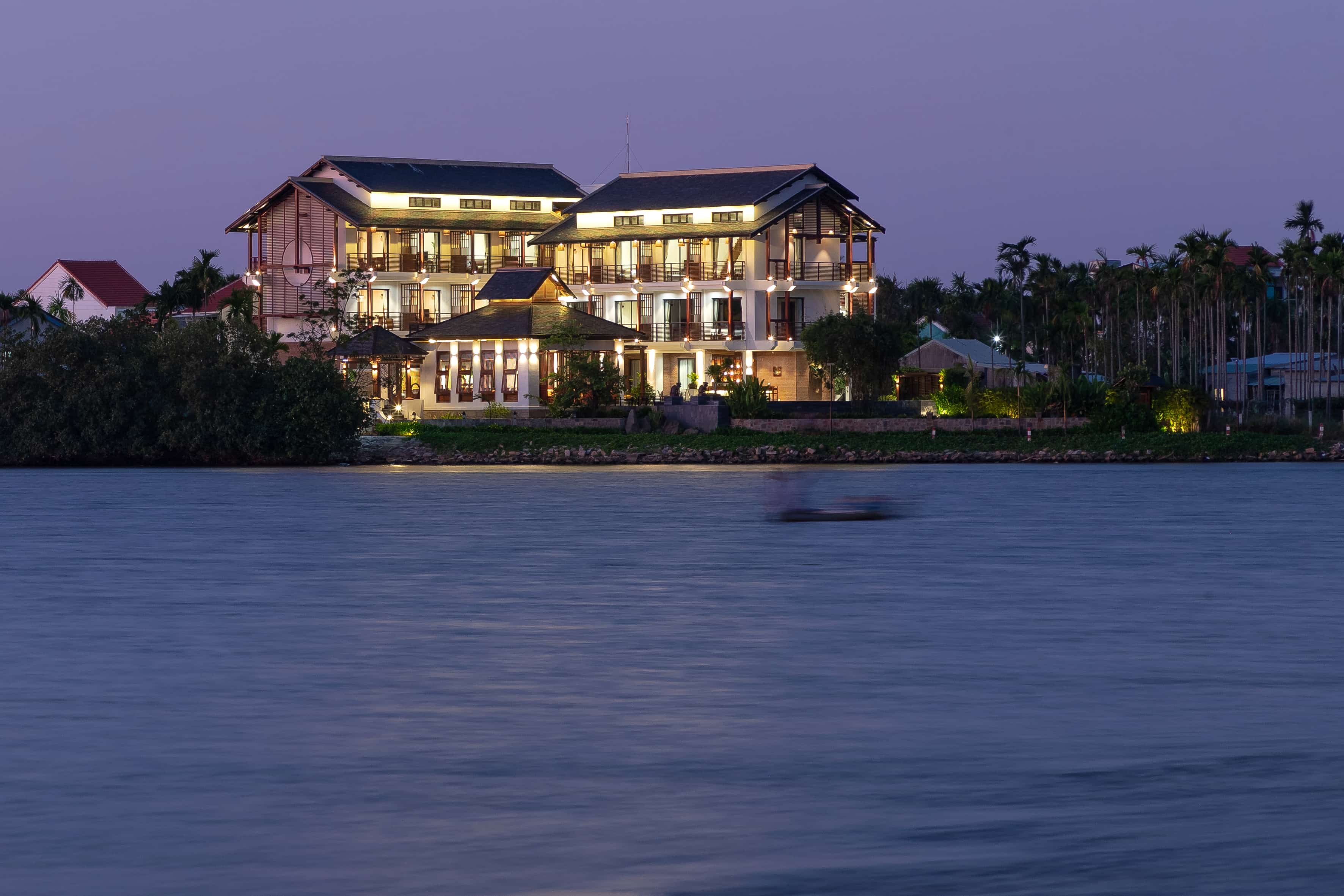 Misty sunrise over the Thu Bồn River at Nghê Prana — a Hoi An riverside hotel and wellness spa