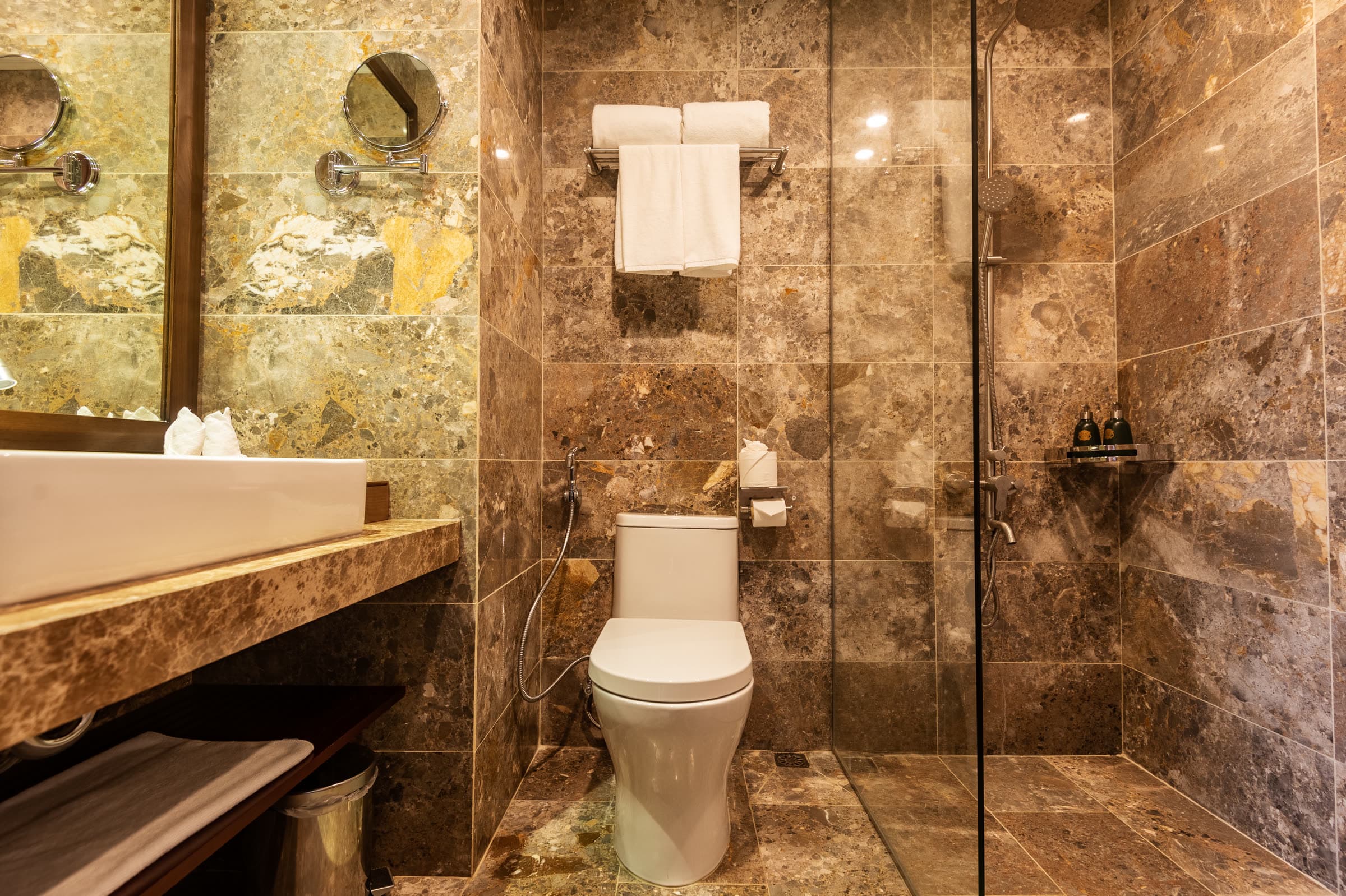 Stone bathroom of the Ying and Yang twin room with a walk-in shower