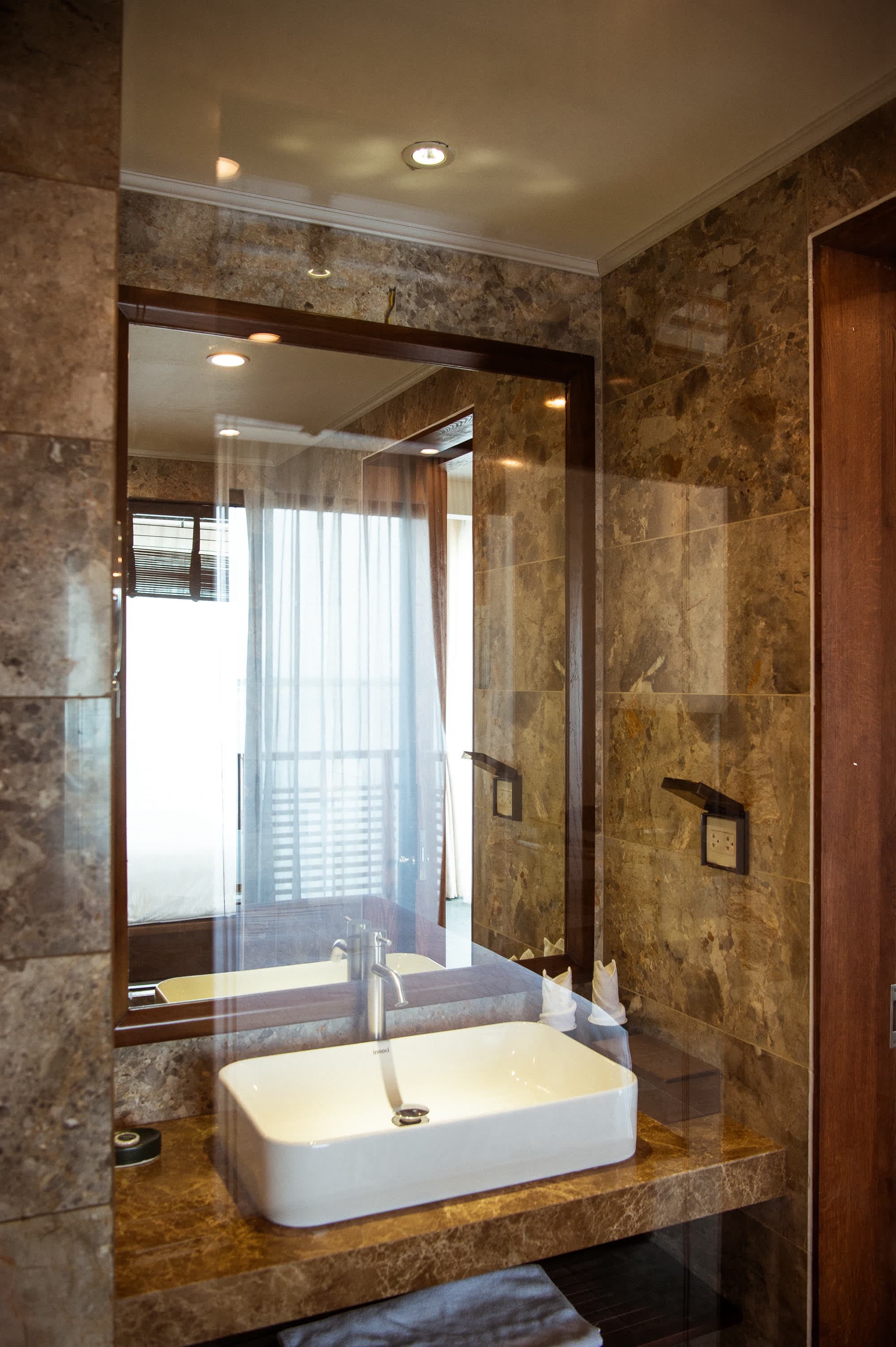 Walk-in shower and stone vanity in the Deluxe Double bathroom