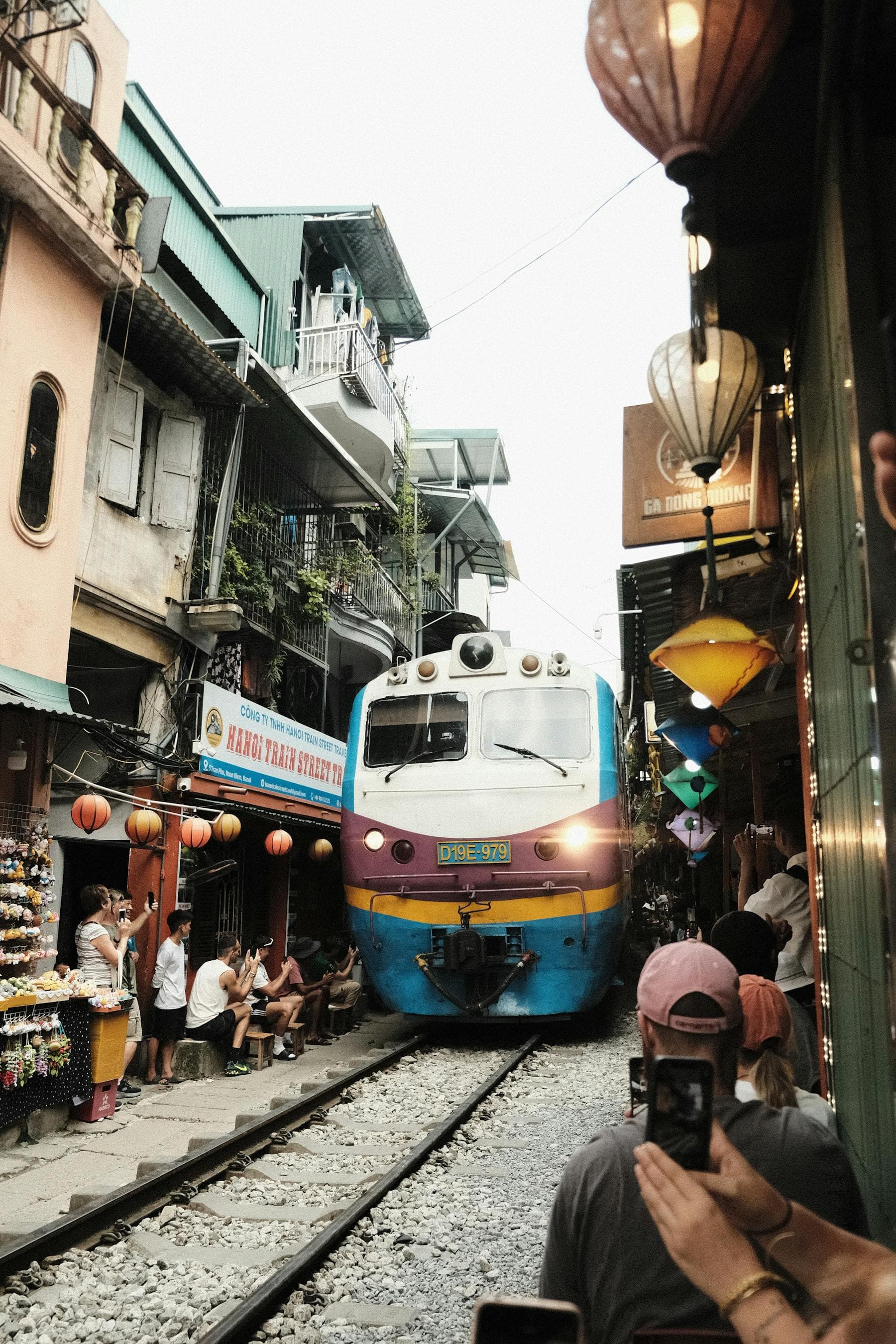 Hanoi Train Street narrow alley with passing train and lanterns in Vietnam Old Quarter — 10 day Vietnam itinerary first timer